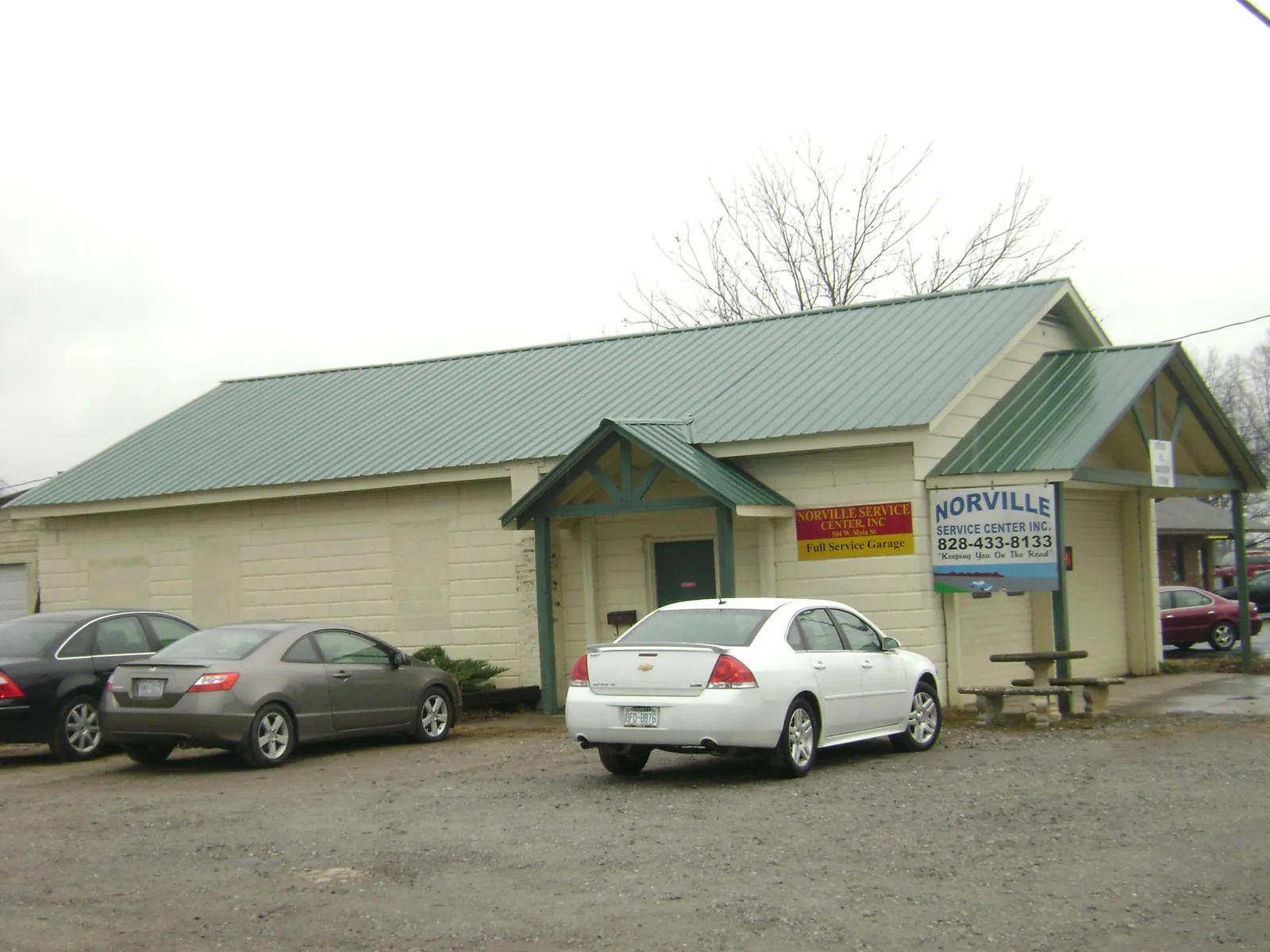 Green metal roof on a service garage with a covered entry in Willingboro